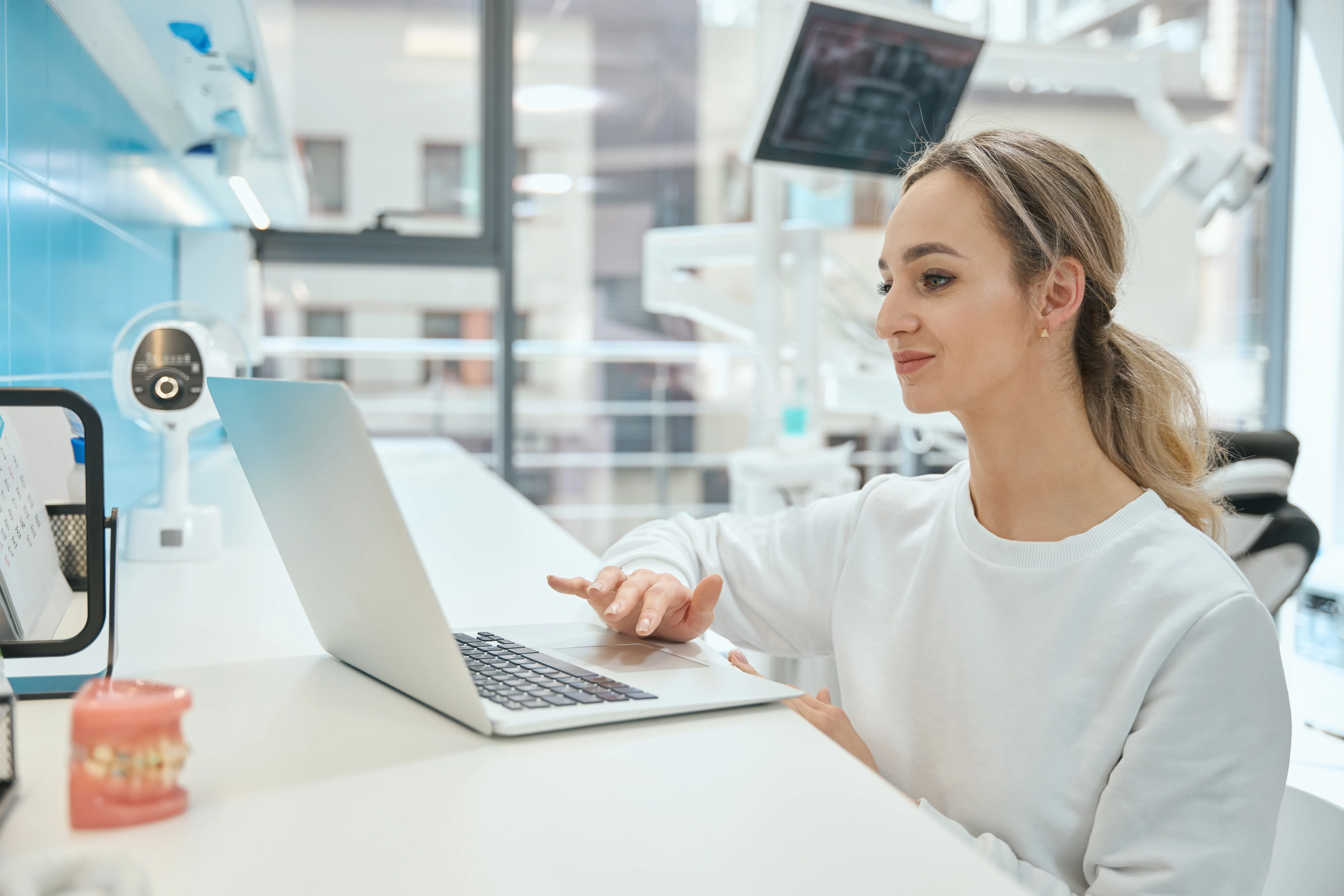 woman-physician-working-on-laptop-in-the-hospital-2026-01-05-06-13-34-utc.webp